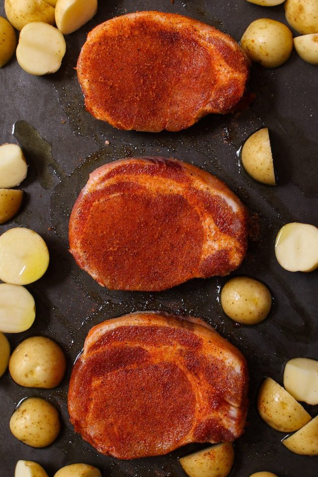 Dry rub seasoning on boneless pork chops before baking