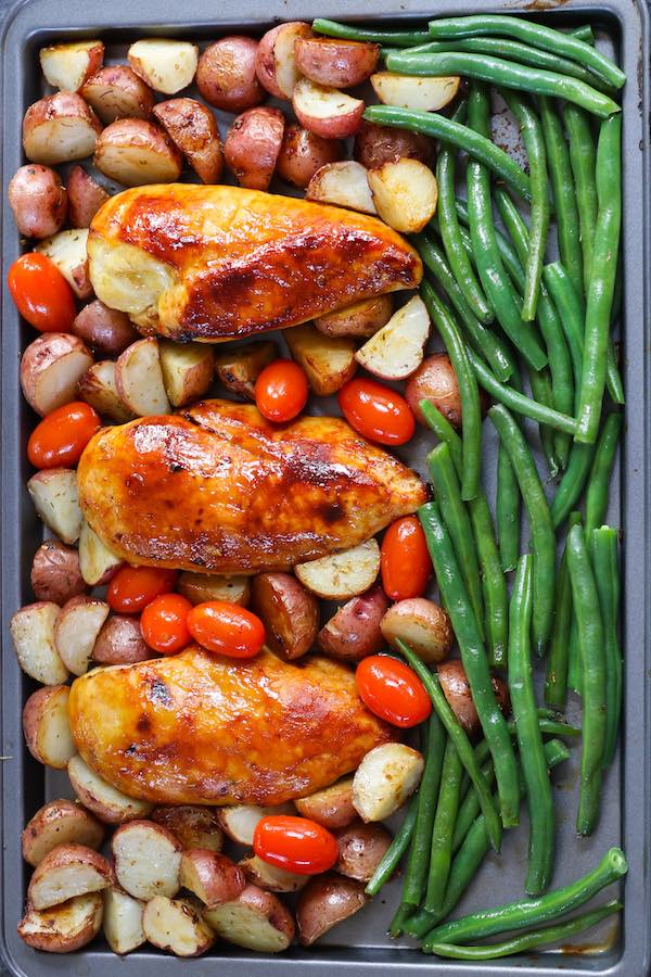 Overhead view of Chicken with Potatoes and Green Beans on a Sheet Pan after baking