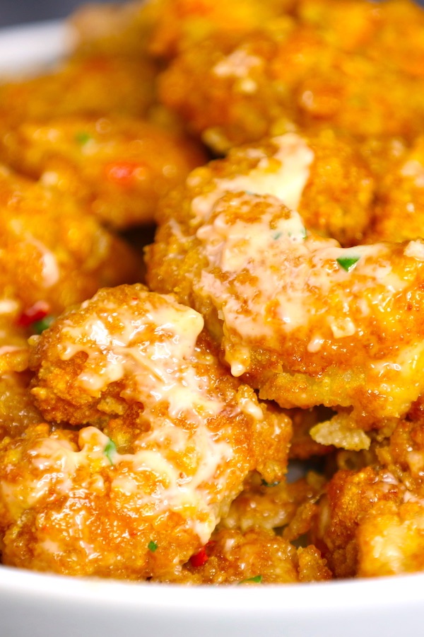 Bang Bang Shrimp is crispy and sizzling shrimp smothered in a creamy, sweet and spicy bang bang sauce. This easy recipe can rival the popular Bonefish Grill bang bang shrimp.