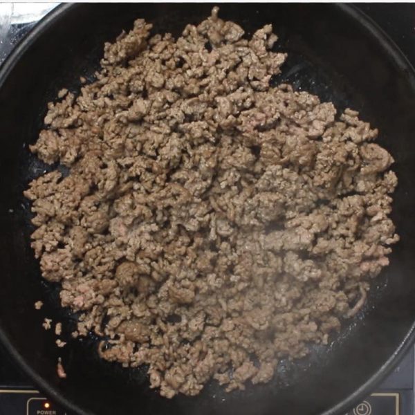 Skillet Shepherd's Pie - this photo shows ground beef being browned in a cast iron skillet