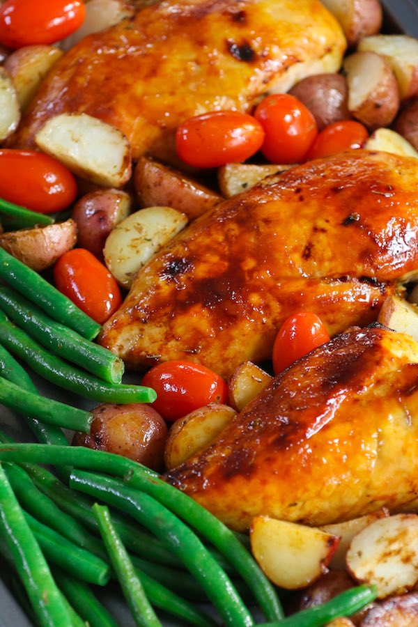 It doesn’t get tastier or healthier than this tender and juicy Chicken with Potatoes and Green Beans. It’s a simple one-pan wonder dish seasoned with Italian spices and roasted to perfection. Easy to prepare with quick cleanup, it’s guaranteed to please! #BakedChickenBreast #ChickenPotatoesGreenbeans