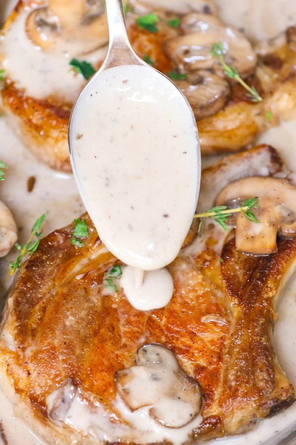 Cream of Mushroom Pork Chops with juicy and tender pork chops smothered in rich and creamy mushroom soup! This comforting Mushroom Pork Chops dish makes an easy dinner recipe for busy nights with one pan and 30 minutes!