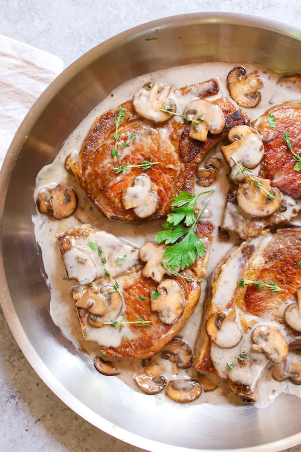 Cream of Mushroom Pork Chops with juicy and tender pork chops smothered in rich and creamy mushroom soup! This comforting Mushroom Pork Chops dish makes an easy dinner recipe for busy nights with one pan and 30 minutes!