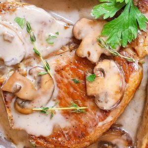 Cream of Mushroom Pork Chops with juicy and tender pork chops smothered in rich and creamy mushroom soup! This comforting Mushroom Pork Chops dish makes an easy dinner recipe for busy nights with one pan and 30 minutes!