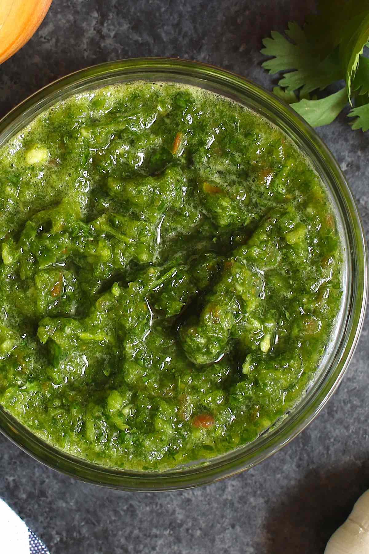 Freshly made sofrito in a clear bowl on the counter