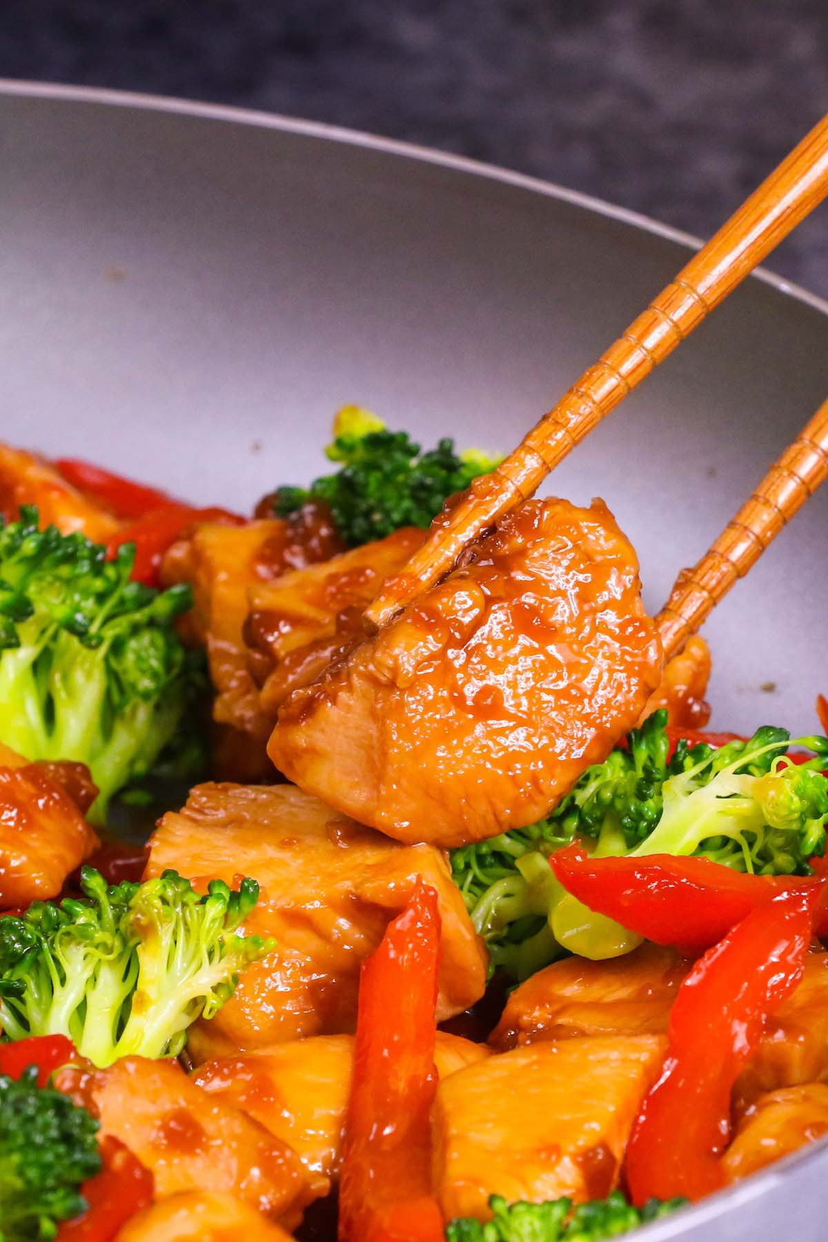 Sticky Honey Garlic Chicken is a simple and fast stir-fry where tender chicken is coated with the 5-ingredient honey garlic sauce. This easy chicken dinner will be on your table in 15 minutes.